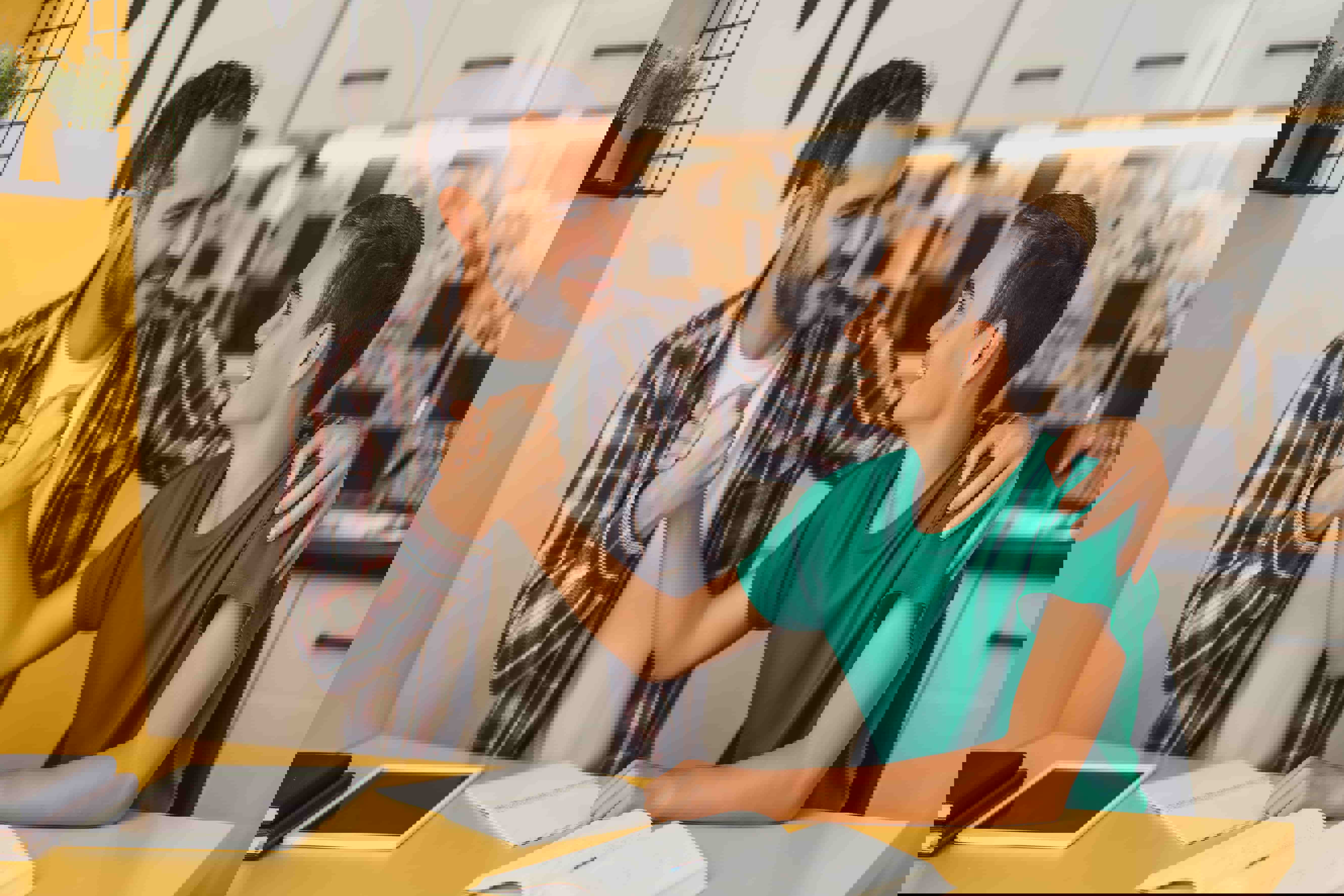 A man assisting his son with his homework